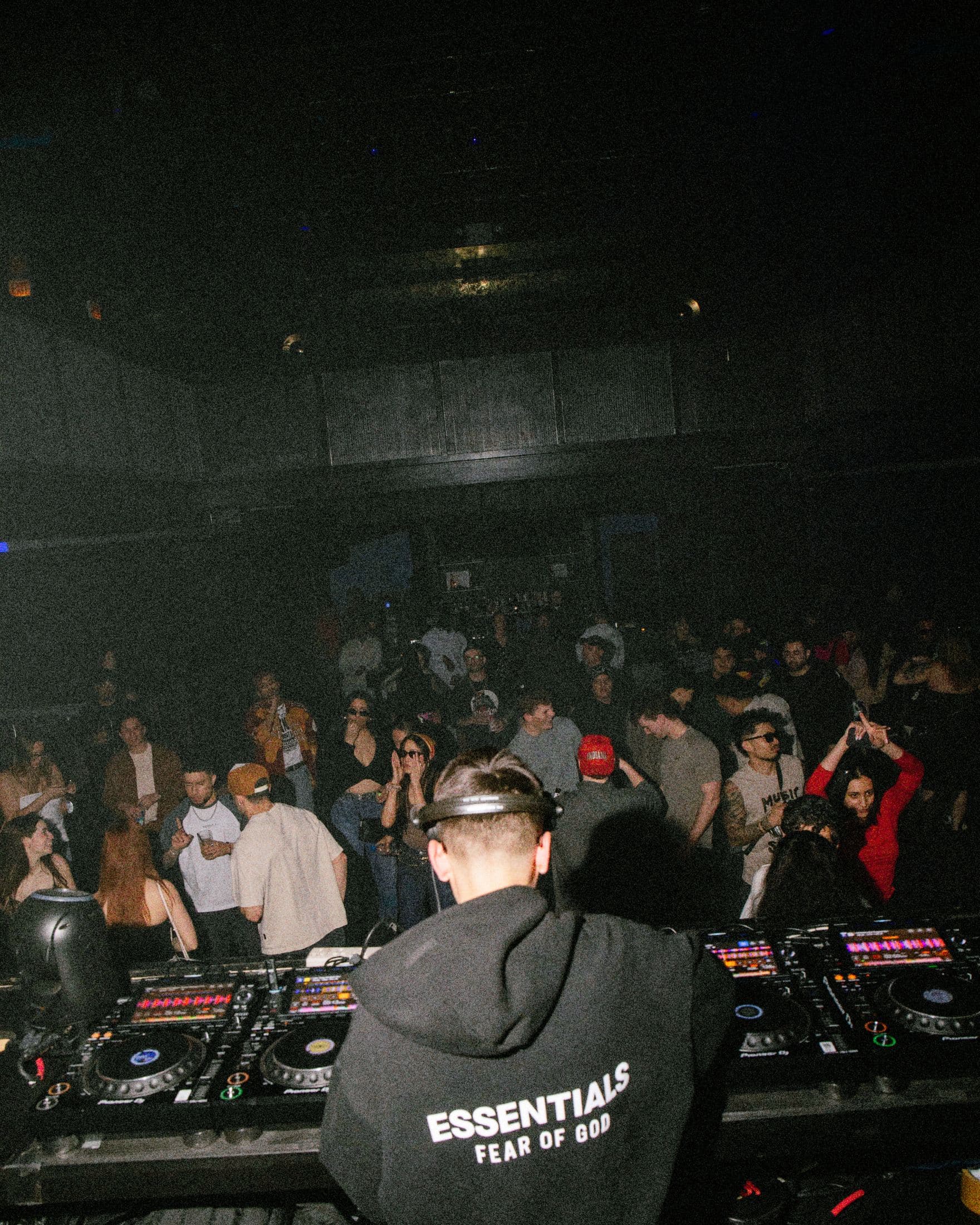 View from the DJ booth over a packed dancefloor