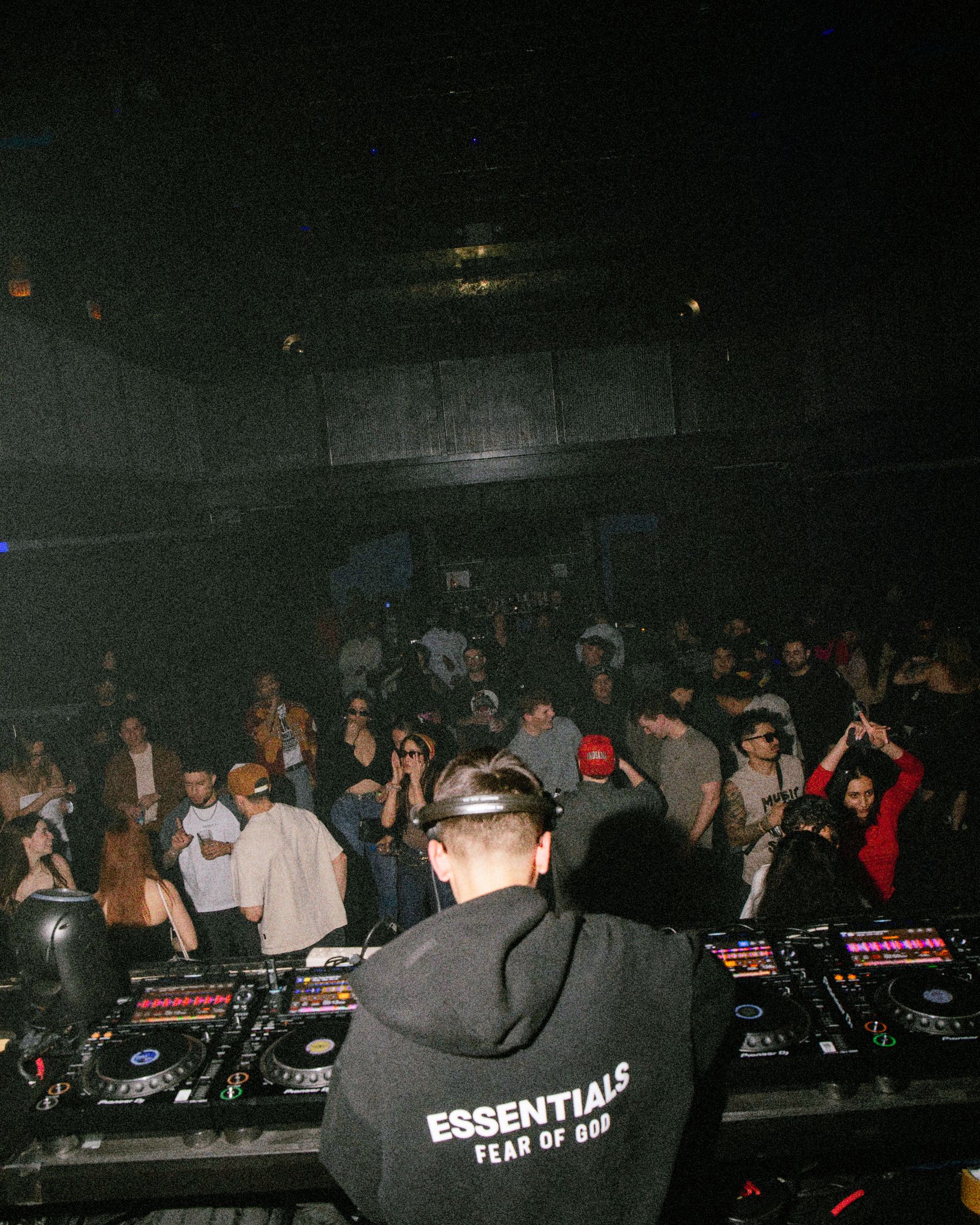 View from the DJ booth over a packed dancefloor